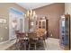 Formal dining room with wooden table and chairs, and built-in hutch at 2223 W Hazelhurst Ct, Anthem, AZ 85086