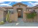 Elegant entryway with a custom wood door and security system at 2223 W Hazelhurst Ct, Anthem, AZ 85086