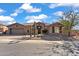 Single-story home with desert landscaping and a three-car garage at 2223 W Hazelhurst Ct, Anthem, AZ 85086