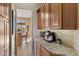 Well-equipped kitchen with granite countertops and espresso machine at 2223 W Hazelhurst Ct, Anthem, AZ 85086