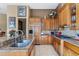 Modern kitchen with stainless steel appliances and granite countertops at 2223 W Hazelhurst Ct, Anthem, AZ 85086