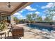 Relaxing pool area with patio furniture and stunning views at 2223 W Hazelhurst Ct, Anthem, AZ 85086