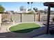 Artificial turf backyard with block wall and walkway at 2300 W Temple St, Chandler, AZ 85224