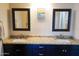 Double vanity bathroom with granite countertops and large mirrors at 2300 W Temple St, Chandler, AZ 85224