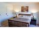 Bedroom with queen-size bed and wood nightstands at 2300 W Temple St, Chandler, AZ 85224