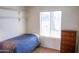 Small bedroom with twin bed and built-in shelving at 2300 W Temple St, Chandler, AZ 85224