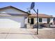 House exterior with a two-car garage and basketball hoop at 2300 W Temple St, Chandler, AZ 85224