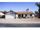 Single-story house with a two-car garage, and a basketball hoop at 2300 W Temple St, Chandler, AZ 85224