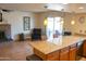 Open kitchen with granite island and breakfast bar at 2300 W Temple St, Chandler, AZ 85224