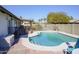 Enjoy this refreshing kidney-shaped pool in your backyard at 2300 W Temple St, Chandler, AZ 85224