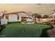 Large backyard with putting green and pool at 255 W Seagull Pl, Chandler, AZ 85286