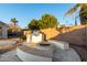 Outdoor kitchen, fire pit, and seating area create a relaxing backyard oasis at 255 W Seagull Pl, Chandler, AZ 85286