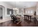 Dining room features hardwood floors, chandelier, and a pool table at 255 W Seagull Pl, Chandler, AZ 85286