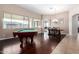 Elegant dining area with a pool table and hardwood floors at 255 W Seagull Pl, Chandler, AZ 85286