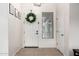 Bright and airy entryway with a wreath and tile flooring at 255 W Seagull Pl, Chandler, AZ 85286