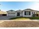 Two-story house with white exterior, landscaped lawn, and a two-car garage at 255 W Seagull Pl, Chandler, AZ 85286