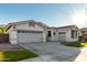 Two-story house with white exterior, landscaped lawn, and a two-car garage at 255 W Seagull Pl, Chandler, AZ 85286