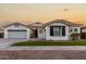 Two-story house with white exterior, landscaped lawn, and a two-car garage at 255 W Seagull Pl, Chandler, AZ 85286