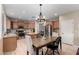 Eat-in kitchen featuring an island, stainless steel appliances, and wood cabinets at 255 W Seagull Pl, Chandler, AZ 85286