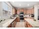 Modern kitchen with stainless steel appliances and granite countertops at 255 W Seagull Pl, Chandler, AZ 85286