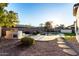 Built-in outdoor kitchen next to the pool and putting green at 255 W Seagull Pl, Chandler, AZ 85286