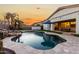 Inviting kidney shaped pool with a waterfall feature at 255 W Seagull Pl, Chandler, AZ 85286