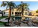 Luxury pool and patio with palm trees and inviting home exterior at 255 W Seagull Pl, Chandler, AZ 85286