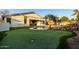 Artificial putting green alongside the pool and home's exterior at 255 W Seagull Pl, Chandler, AZ 85286