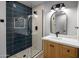 Modern bathroom featuring a tiled shower with glass door and vanity with white countertop at 25838 N 104Th Pl, Scottsdale, AZ 85255