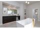 Elegant bathroom with a soaking tub and modern double vanity at 25838 N 104Th Pl, Scottsdale, AZ 85255