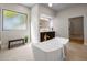 Modern bathroom with freestanding bathtub and gold fixtures at 25838 N 104Th Pl, Scottsdale, AZ 85255