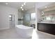 Luxurious bathroom featuring a freestanding tub and walk-in shower at 25838 N 104Th Pl, Scottsdale, AZ 85255