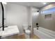 Bright bathroom featuring a shower-tub combo, sleek fixtures, and a vanity with a white countertop at 25838 N 104Th Pl, Scottsdale, AZ 85255