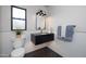 Stylish bathroom featuring a floating vanity, gold fixtures, and patterned tile at 25838 N 104Th Pl, Scottsdale, AZ 85255