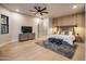 Modern bedroom with wood feature wall and plush rug at 25838 N 104Th Pl, Scottsdale, AZ 85255