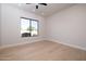 Bright bedroom with large window and wood flooring at 25838 N 104Th Pl, Scottsdale, AZ 85255