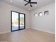 Bedroom with sliding glass door to patio at 25838 N 104Th Pl, Scottsdale, AZ 85255