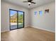 Light-filled bedroom with a sliding door, mountain views and wood floors at 25838 N 104Th Pl, Scottsdale, AZ 85255