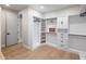 Well-organized walk-in closet with custom shelving, drawers, and ample storage space at 25838 N 104Th Pl, Scottsdale, AZ 85255