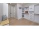 Large walk-in closet with ample shelving and drawers at 25838 N 104Th Pl, Scottsdale, AZ 85255