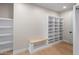 Walk-in closet with shelves and bench at 25838 N 104Th Pl, Scottsdale, AZ 85255