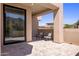 Covered patio with comfortable seating, stylish decor, and serene views of the surrounding desert landscape and mountains at 25838 N 104Th Pl, Scottsdale, AZ 85255