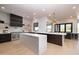 Modern kitchen with marble island and wine storage at 25838 N 104Th Pl, Scottsdale, AZ 85255