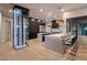 Modern kitchen with marble countertops and wine storage at 25838 N 104Th Pl, Scottsdale, AZ 85255