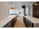 Modern kitchen with marble countertops and dark wood cabinetry at 25838 N 104Th Pl, Scottsdale, AZ 85255