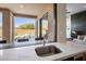 Kitchen view highlighting the marble countertop and outdoor scenic view at 25838 N 104Th Pl, Scottsdale, AZ 85255