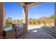 Outdoor grill area featuring stainless steel grill, granite countertop, and easy access to landscaped backyard and scenic desert views at 25838 N 104Th Pl, Scottsdale, AZ 85255