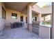 Covered patio with built-in grill and outdoor dining area at 25838 N 104Th Pl, Scottsdale, AZ 85255