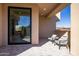 Private patio with modern chairs and glass doors at 25838 N 104Th Pl, Scottsdale, AZ 85255