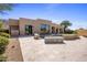 Expansive backyard patio with built-in fire pit at 25838 N 104Th Pl, Scottsdale, AZ 85255